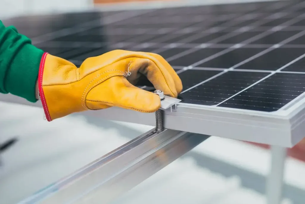 select the best solar panels for your home-man setting up solar panel